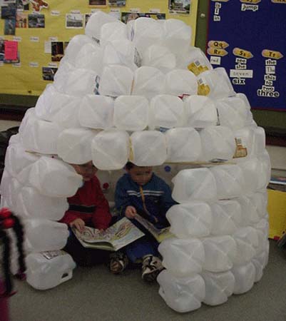 children reading inside an igloo at Meadow Montessori School in South Richmond, TX