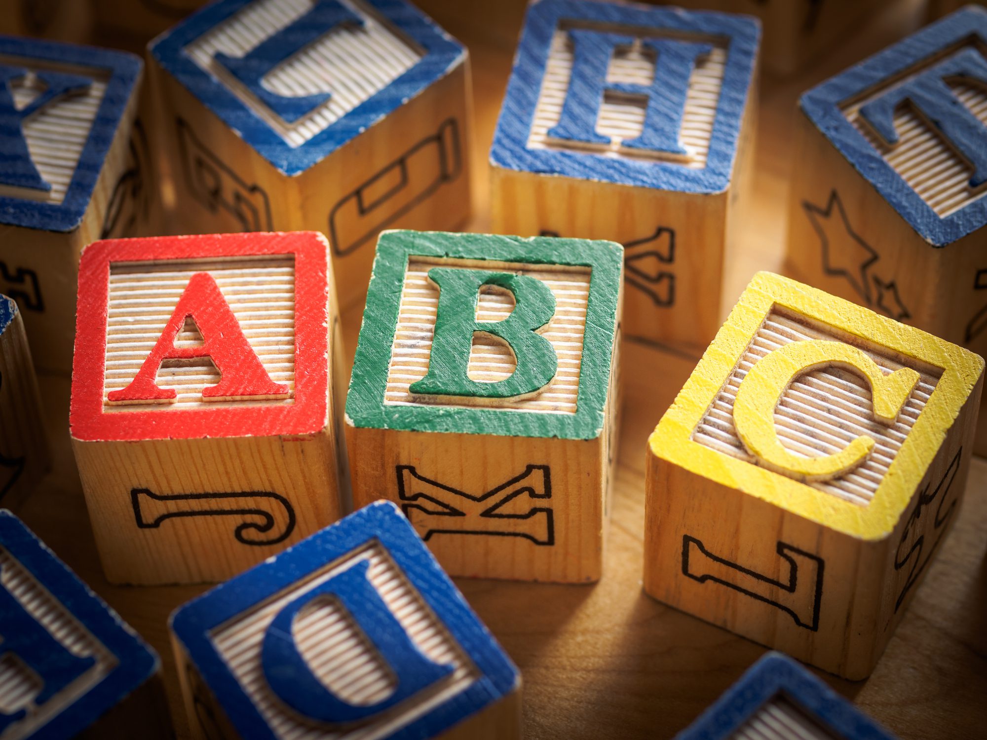 Three blocks spelling out a red A, a green B, and a yellow C