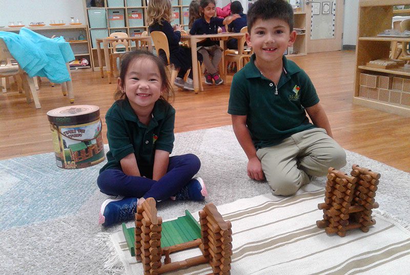 Childten at Meadow Montessori School playing with Lincoln logs