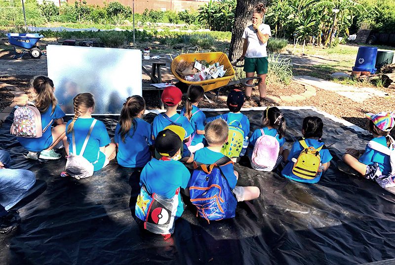 Students from Meadow Montessori School on a field trip learning about plants