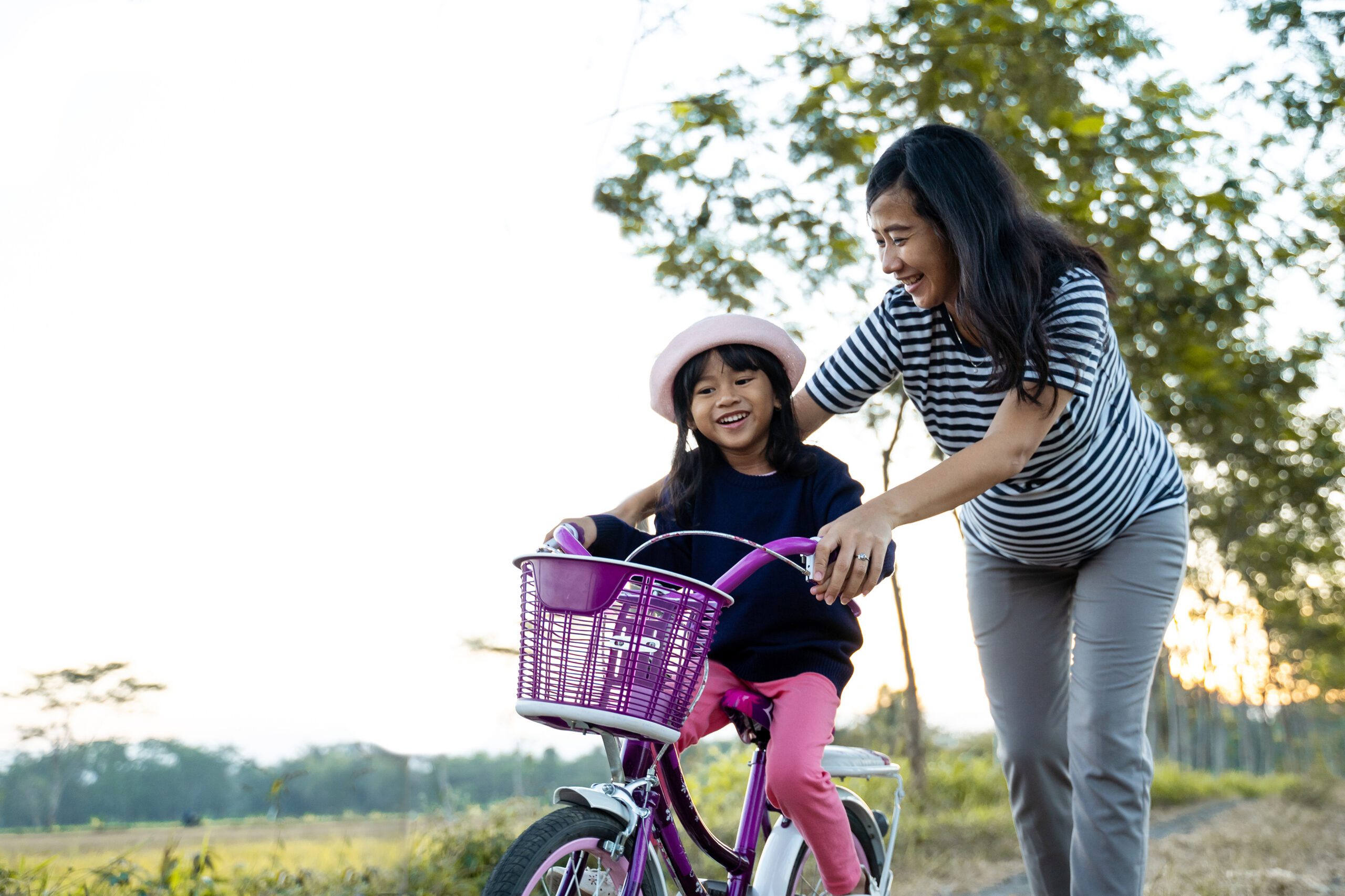 teaching a kid how to ride a bike