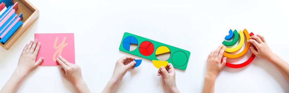 children putting together building blocks and learning toys