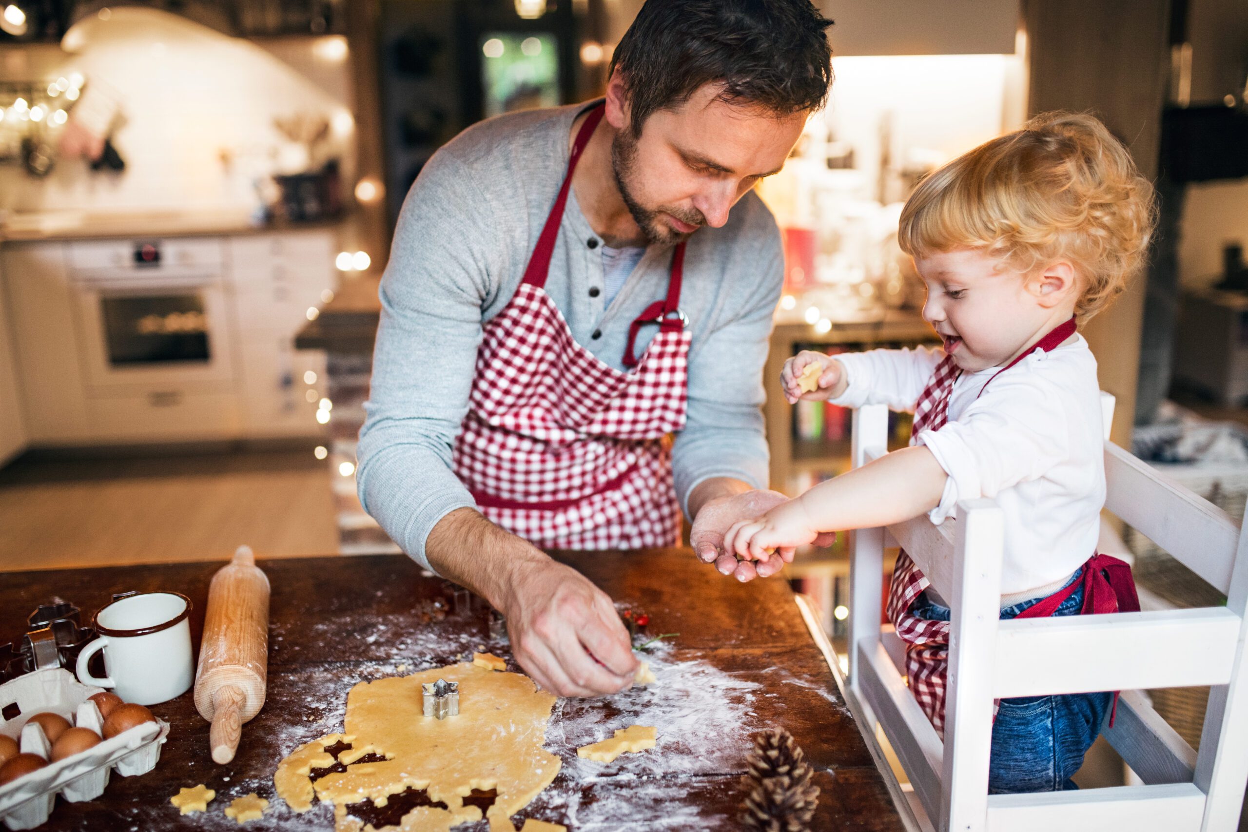 father and son baking holiday cookies