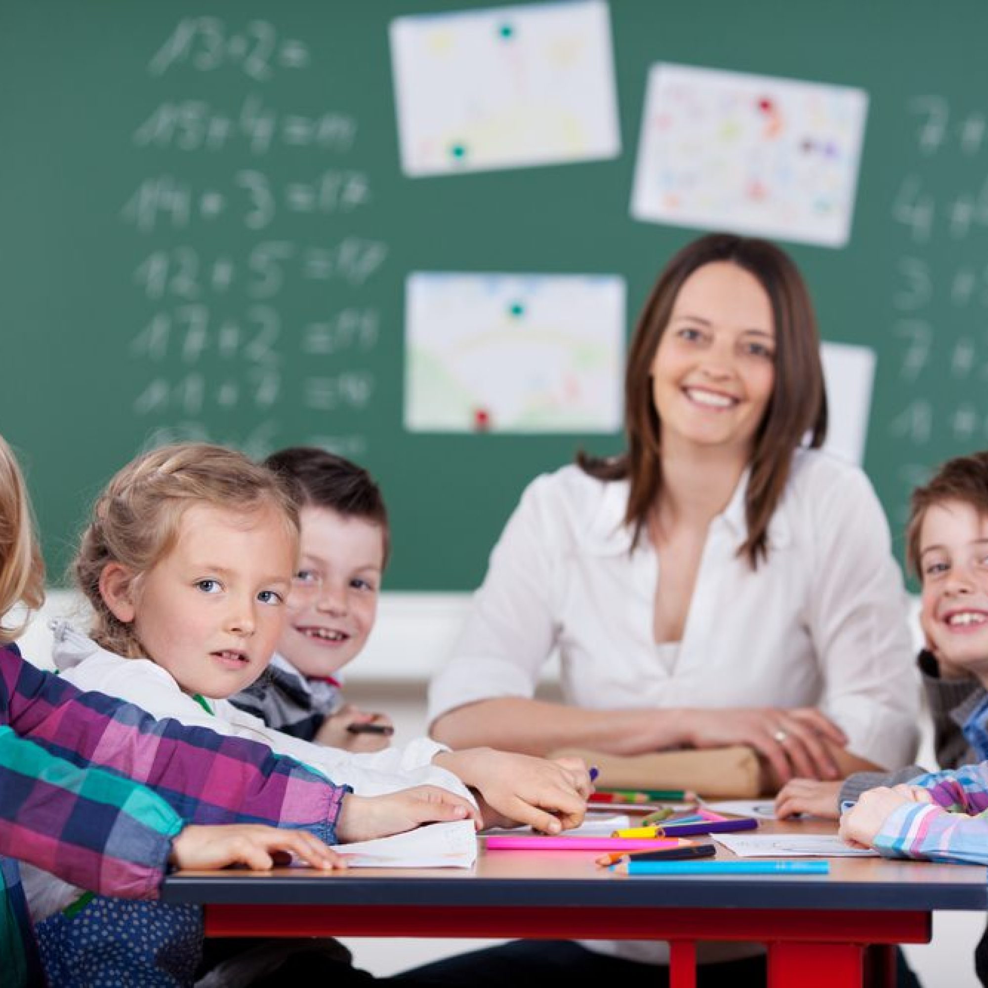 Montessori teacher and children